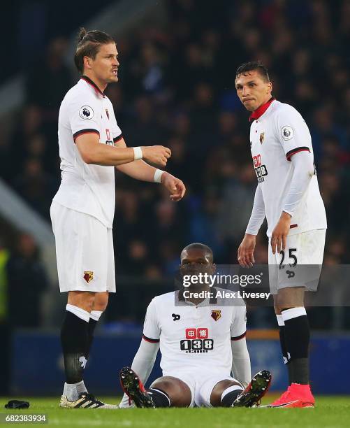 Sebastian Prodl of Watford and Jose Holebas of Watford check if Christian Kabasele of Watford is okay during the Premier League match between Everton...