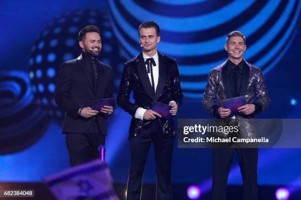 Presenters Timur Miroshnychenko, Oleksandr Skichko and Volodymyr Ostapchuk speak on stage during the rehearsal for the final of the 62nd Eurovision...