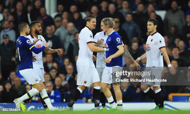 Sebastian Prodl of Watford attempts to hold back Tom Davies of Everton during the Premier League match between Everton and Watford at Goodison Park...