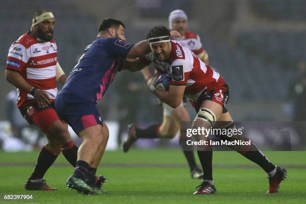 Jeremy Thrush of Gloucester charges into Rabah Slimani of Stade Francais during the European Rugby Challenge Cup Final between Gloucester and Stade...