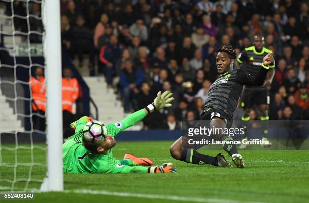 Michy Batshuayi of Chelsea scores his sides first goal past Ben Foster of West Bromwich Albion during the Premier League match between West Bromwich...