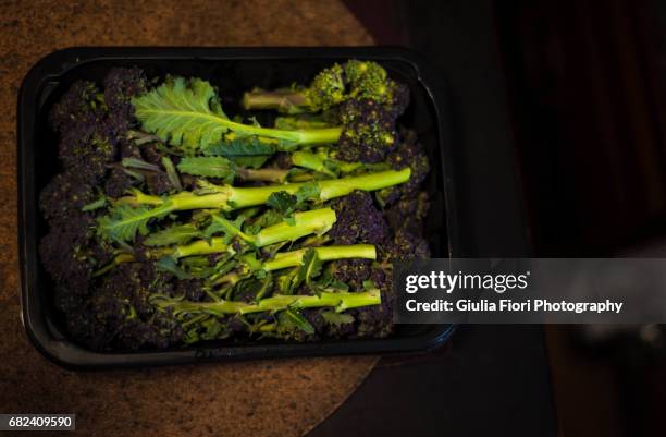 purple sprouting broccoli in a kitchen - purple sprouting broccoli stock pictures, royalty-free photos & images