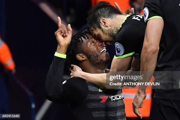 Chelsea's Belgian striker Michy Batshuayi celebrates with teammates scoring the opening goal during the English Premier League match between West...