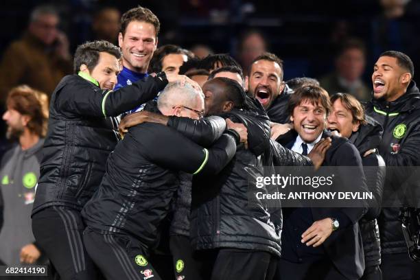 Chelsea's Italian head coach Antonio Conte leads celebrations of Chelsea's Belgian striker Michy Batshuayi scoring the opening goal during the...