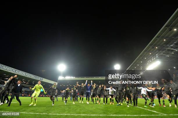 Chelsea's Italian head coach Antonio Conte leads celebrations of victory after the English Premier League match between West Bromwich Albion and...