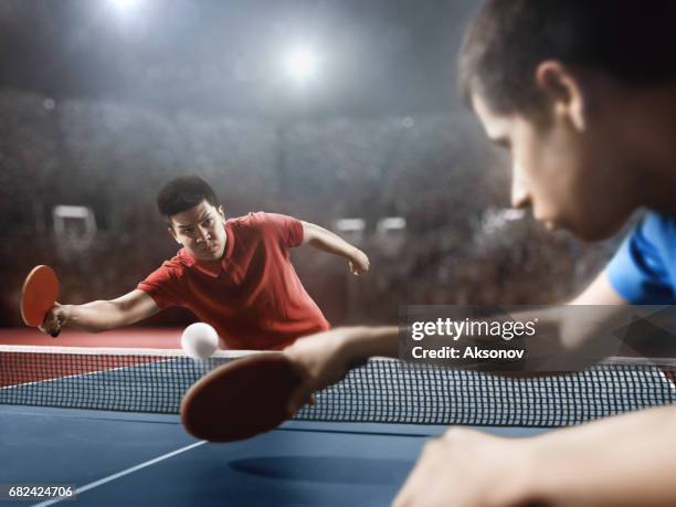 two ping pong players play table tennis - table tennis world championships stock pictures, royalty-free photos & images