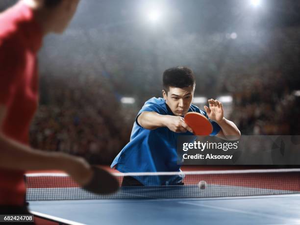 two ping pong players play table tennis - campeonato mundial de ténis de mesa imagens e fotografias de stock