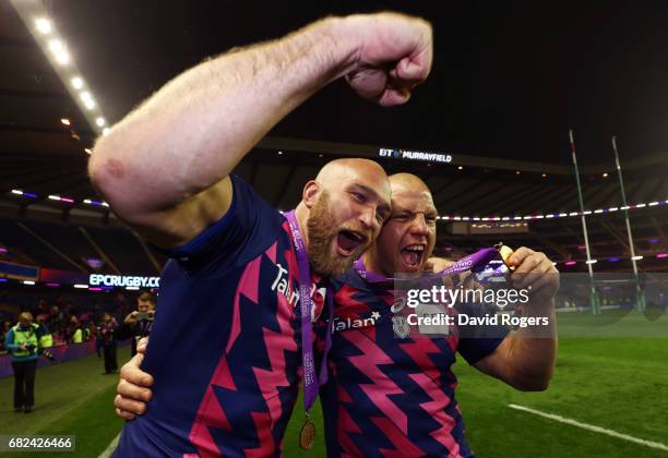 Antoine Burban and Heinke Van der Merwe of Stade Francais celebrate following their team's 25-17 victory during the European Rugby Challenge Cup...