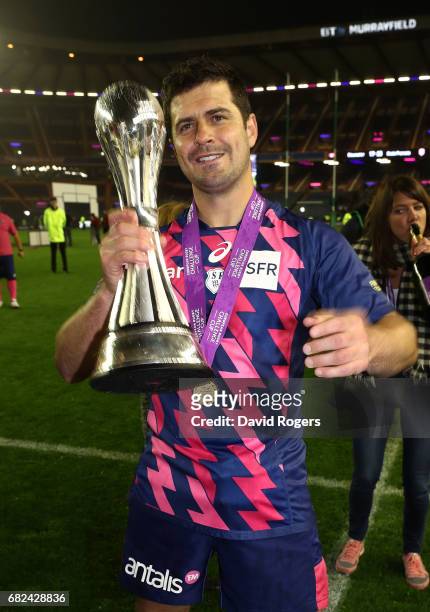 Morne Steyn of Stade Francais celebrates with the trophy following his team's 25-17 victory during the European Rugby Challenge Cup Final between...