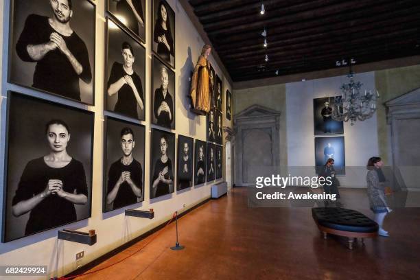 Visitors attend the collaterals exhibition 'Shirin Neshat The Home of My Eyes' of Written Art Foundation during the 57th Biennale Arte on May 12,...