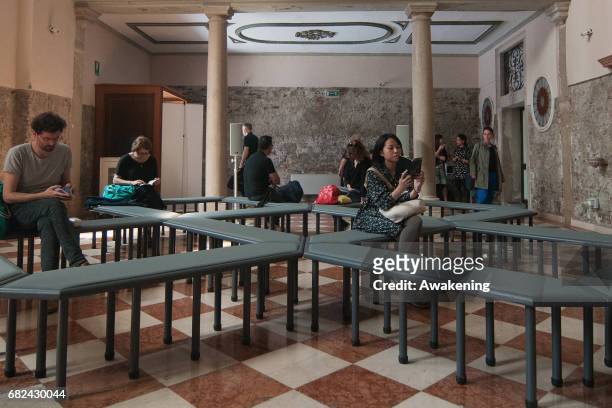 Visitors attend the collateral exhibition 'Wales in Venice: James Richards' of Cymru yn Fenis Wales in Venice during the 57th Biennale Arte on May...
