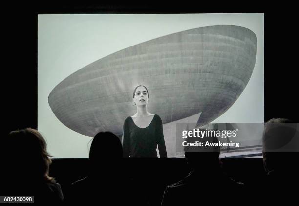 Visitors attend the collaterals exhibition 'Shirin Neshat The Home of My Eyes' of Written Art Foundation during the 57th Biennale Arte on May 12,...