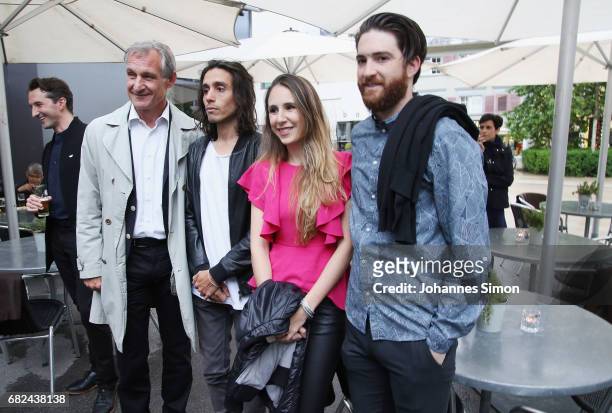 Argentine artist Adrian Villar Rojas poses with Bregenz lord mayor Markus Linhart and guests during the opening of his exhibition 'The Theater of...