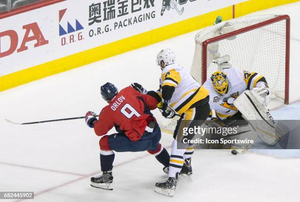Pittsburgh Penguins goalie Marc-Andre Fleury stops a shot from Washington Capitals defenseman Dmitry Orlov during game 7 of the Stanley Cup Eastern...