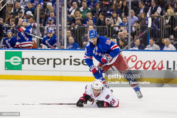 New York Rangers defenseman Marc Staal sends Ottawa Senators left wing Mike Hoffman to the ice during the first period of game 4 of the second round...