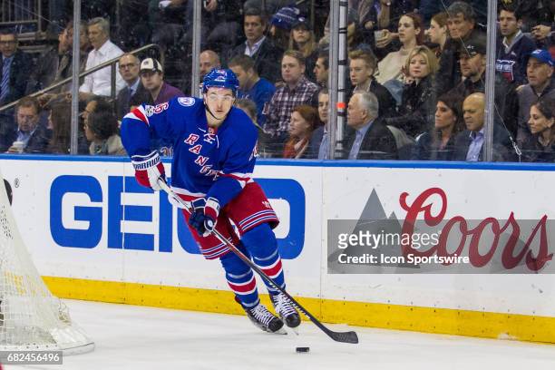 New York Rangers left wing Jimmy Vesey takes the puck out from behind the Rangers net during the first period of game 4 of the second round of the...