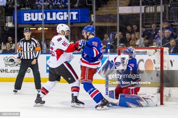 Ottawa Senators left wing Clarke MacArthur checks New York Rangers defenseman Brady Skjei in front of New York Rangers goalie Henrik Lundqvist during...