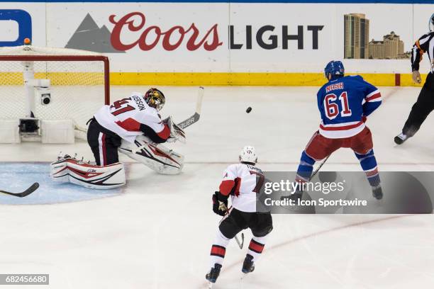 New York Rangers left wing Rick Nash picks up the rebound off of Ottawa Senators goalie Craig Anderson during the second period of game 4 of the...