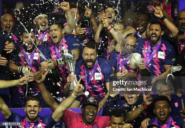 Stade Francais celebrate with the trophy following their team's 25-17 victory during the European Rugby Challenge Cup Final between Gloucester and...