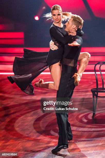 Maximilian Arland and Sarah Latton perform on stage during the 8th show of the tenth season of the television competition 'Let's Dance' on May 12,...