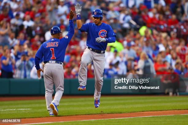 Willson Contreras of the Chicago Cubs celebrates after hitting a solo home run against the St. Louis Cardinals in the second inning at Busch Stadium...