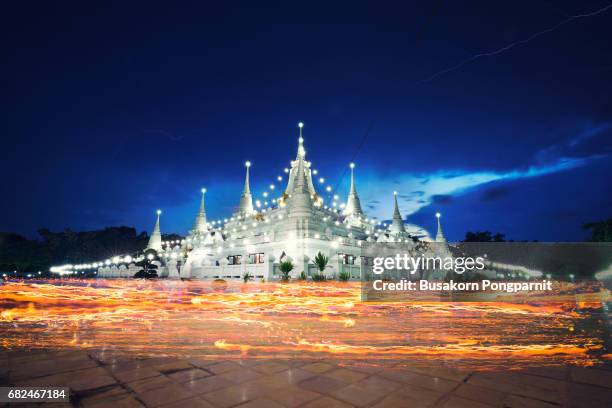 visakabucha day, there is traditionally lighting of candle, circumambulation and meditation to pay homage to the lord buddha - buddha purnima stock pictures, royalty-free photos & images