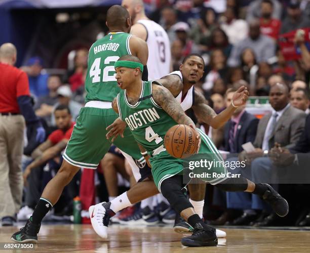 Isaiah Thomas of the Boston Celtics drives away from Bradley Beal of the Washington Wizards during Game Six of the NBA Eastern Conference Semi-Finals...