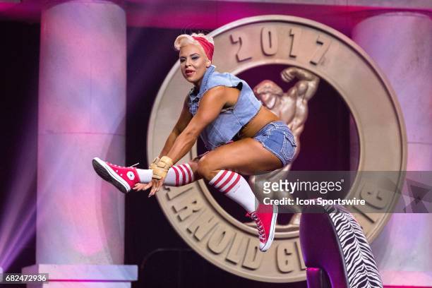 Ashley Sebera , also known as WWE Superstar Dana Brooke, competes in Fitness International as part of the Arnold Sports Festival on March 3 at the...