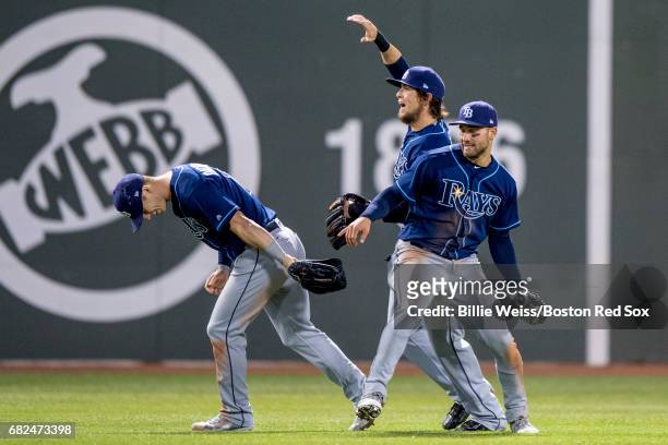 Kevin Kiermaier, Corey Dickerson, and Colby Rasmus of the Tampa Bay Rays celebrate a victory against the Boston Red Sox on May 12, 2017 at Fenway...