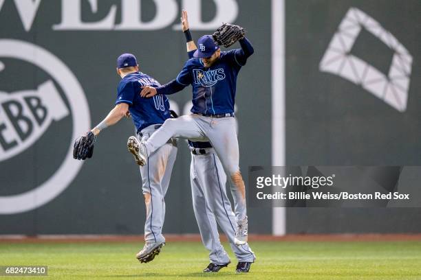 Kevin Kiermaier, Corey Dickerson, and Colby Rasmus of the Tampa Bay Rays celebrate a victory against the Boston Red Sox on May 12, 2017 at Fenway...