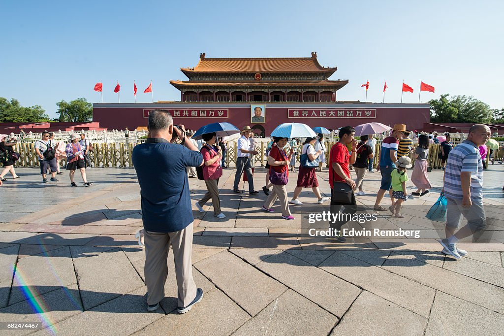 Tourists taking photos of the Meridian Gate