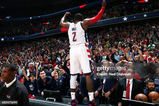 John Wall of the Washington Wizards celebrates their victory after the game against the Boston Celtics during Game Six of the Eastern Conference...