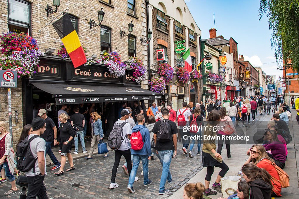 People walking down a busy street in Dublin