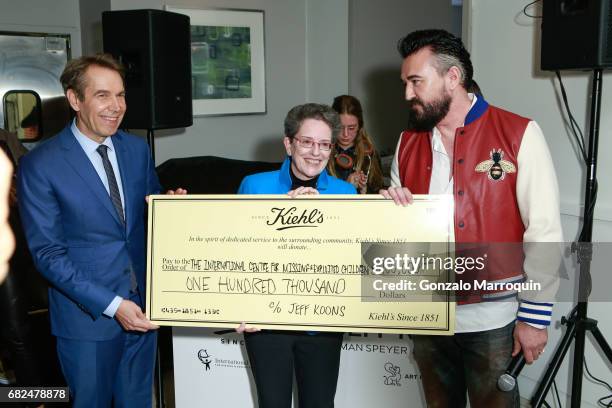 Jeff Koons, Maura Harty, Chris Salgardo attend the Kiehl's Since 1851, Art Production Fund and Saks Fifth Avenue Celebrate the Unveiling of "Seated...