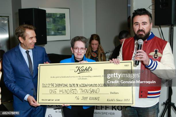 Jeff Koons, Maura Harty, Chris Salgardo attend the Kiehl's Since 1851, Art Production Fund and Saks Fifth Avenue Celebrate the Unveiling of "Seated...