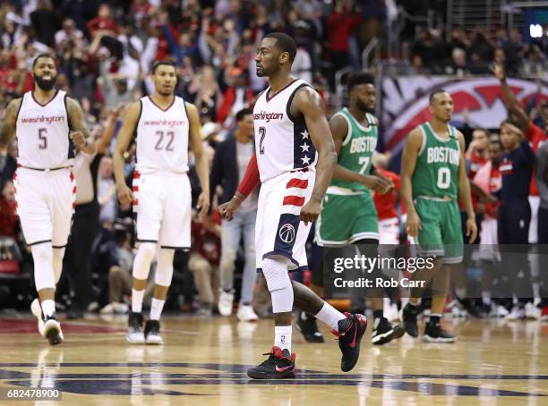John Wall of the Washington Wizards shoots the game-winning three-point basket against Avery Bradley of the Boston Celtics during Game Six of the NBA...