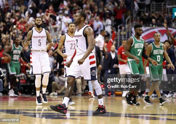 John Wall of the Washington Wizards shoots the game-winning three-point basket against Avery Bradley of the Boston Celtics during Game Six of the NBA...