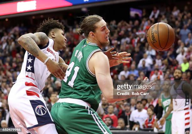 Kelly Oubre Jr. #12 of the Washington Wizards defends against Kelly Olynyk of the Boston Celtics during Game Six of the NBA Eastern Conference...