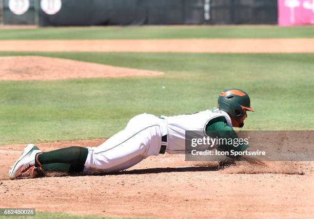 Miami infielder Edgar Michelangeli scores during a college baseball game between the Bethune-Cookman University Wildcats and the University of Miami...