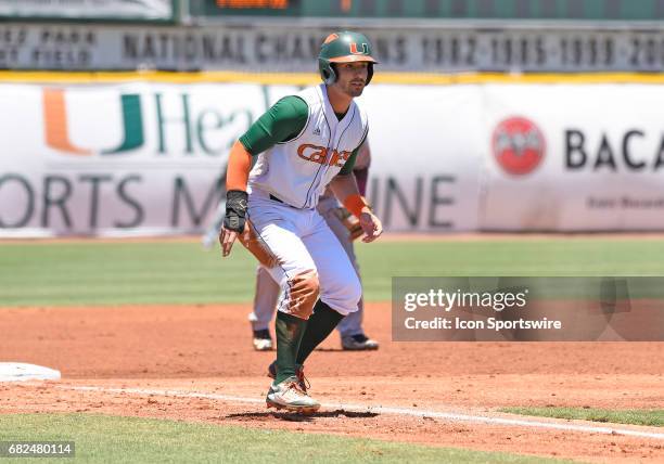 Miami infielder Johnny Ruiz takes a lead during a college baseball game between the Bethune-Cookman University Wildcats and the University of Miami...