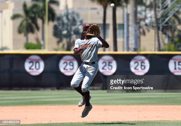 Bethune infielder Demetrius Sims jumps for a high hopper during a college baseball game between the Bethune-Cookman University Wildcats and the...