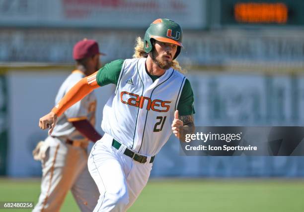 Miami outfielder Hunter Tackett scores during a college baseball game between the Bethune-Cookman University Wildcats and the University of Miami...