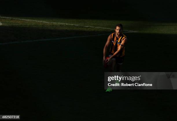 Luke Hodge of the Hawks runs with the ball during the round eight AFL match between the Hawthorn Hawks and the Brisbane Lions at University of...