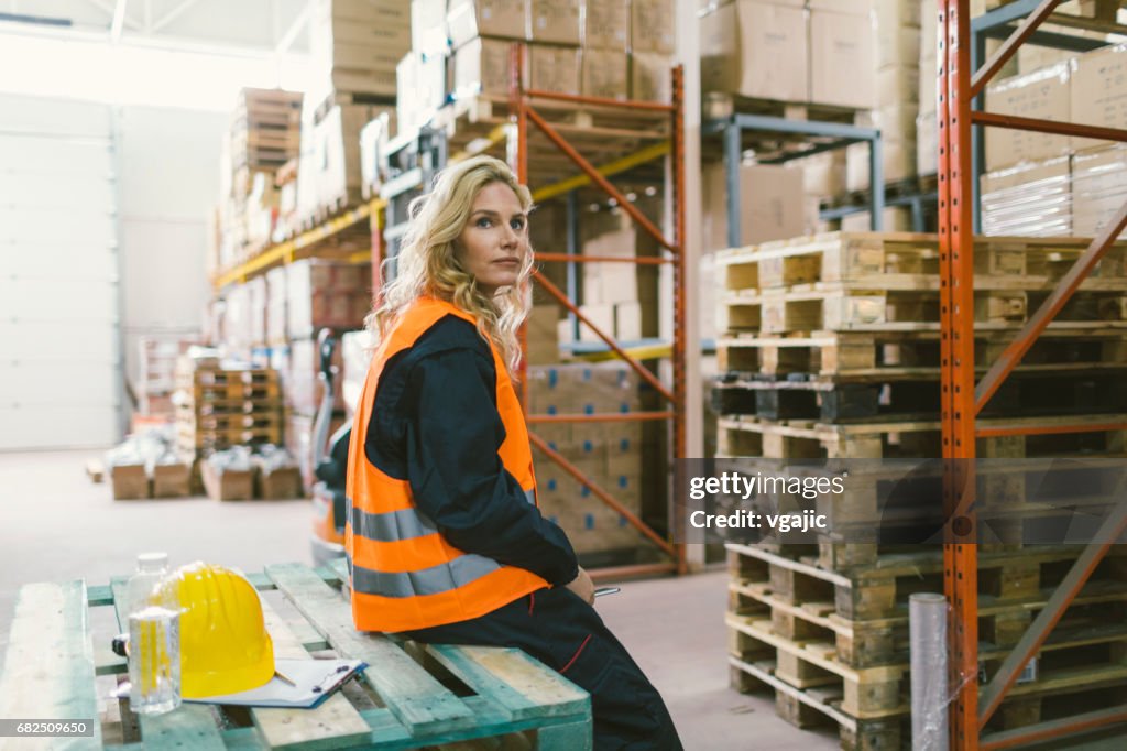 Female worker in warehouse