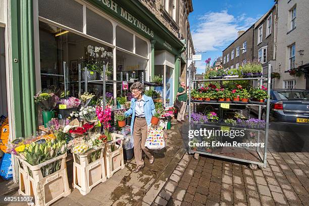 woman shopping for plants and flowers - richmond yorkshire stock pictures, royalty-free photos & images