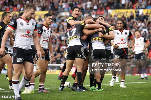 Matt Moylan of the Panthers celebrates with his team mates after scoring a try during the round 10 NRL match between the Penrith Panthers and the New...