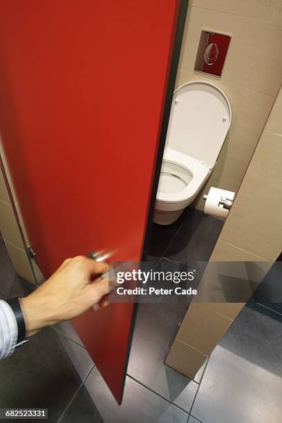 hand opening toilet door - toilet door stock pictures, royalty-free photos & images