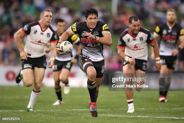 Dallin Watene-Zelezniak of the Panthers makes a break during the round 10 NRL match between the Penrith Panthers and the New Zealand Warriors at...