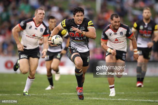 Dallin Watene-Zelezniak of the Panthers makes a break during the round 10 NRL match between the Penrith Panthers and the New Zealand Warriors at...