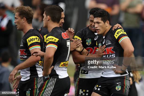 Dallin Watene-Zelezniak of the Panthers celebrates with his team mates after scoring a try during the round 10 NRL match between the Penrith Panthers...